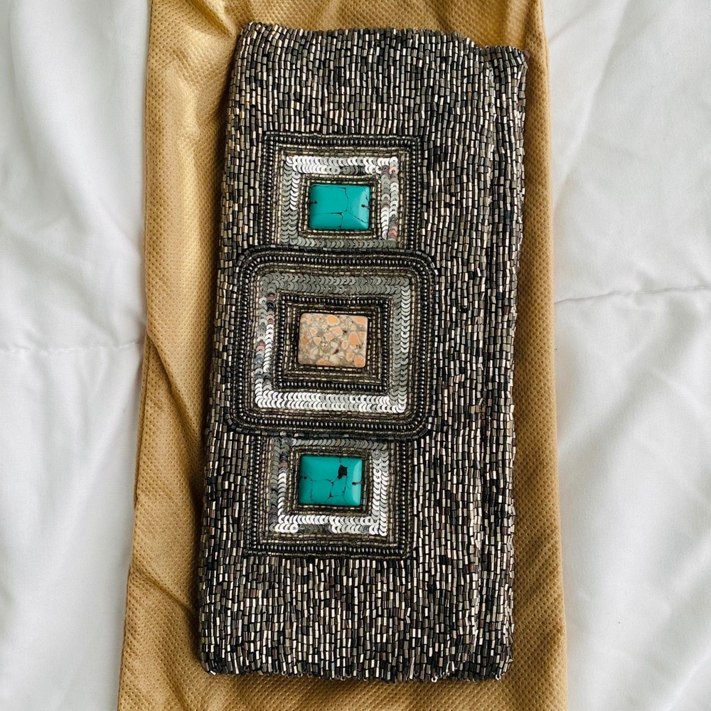 Moyna from CUSP silver clutch